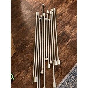 Lot of 11 brushed steel extendable curtain poles various sizes (see description)